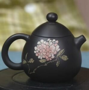 Handmade Jianshui Zitao teapot with floral painting, made from natural clay using traditional heritage techniques