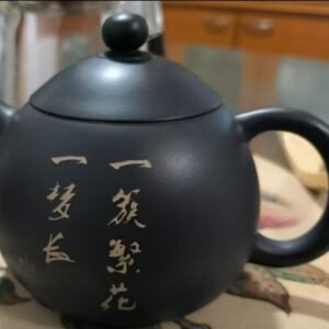 Handmade Jianshui Zitao teapot with floral painting, made from natural clay using traditional heritage techniques