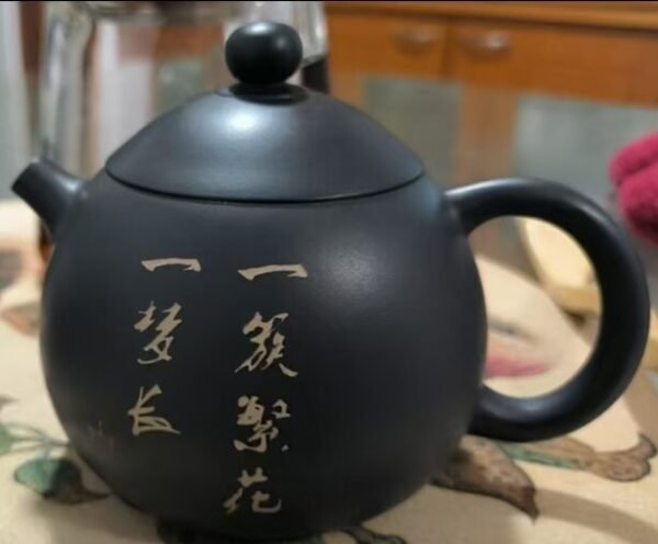 Handmade Jianshui Zitao teapot with floral painting, made from natural clay using traditional heritage techniques