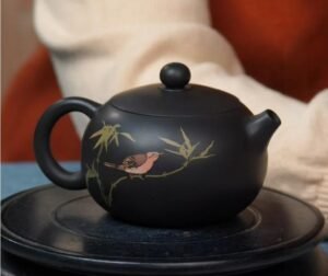Jianshui Zitao teapot with hand-painted rooster artwork, crafted from natural mineral clay using intangible cultural heritage methods