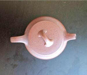 yixing-zisha-handmade-teapot-natural-clay-lotus-design.jpg - A TEA STORY Handmade Yixing Zisha teapot crafted from natural clay with elegant lotus design